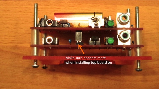 Slide first circuit board (Channel 1) through screws and on top of bottom board (Channel 2). Ensure the connections mate.