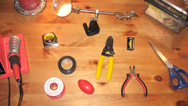 You will need a Soldering Iron, some solder, a magnifying glass, a 9V battery, silly putty, a pair of scissors, wire strippers, wire clippers, superglue, and Electrical Tape