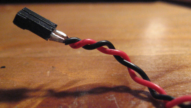 Twist the two wires together.